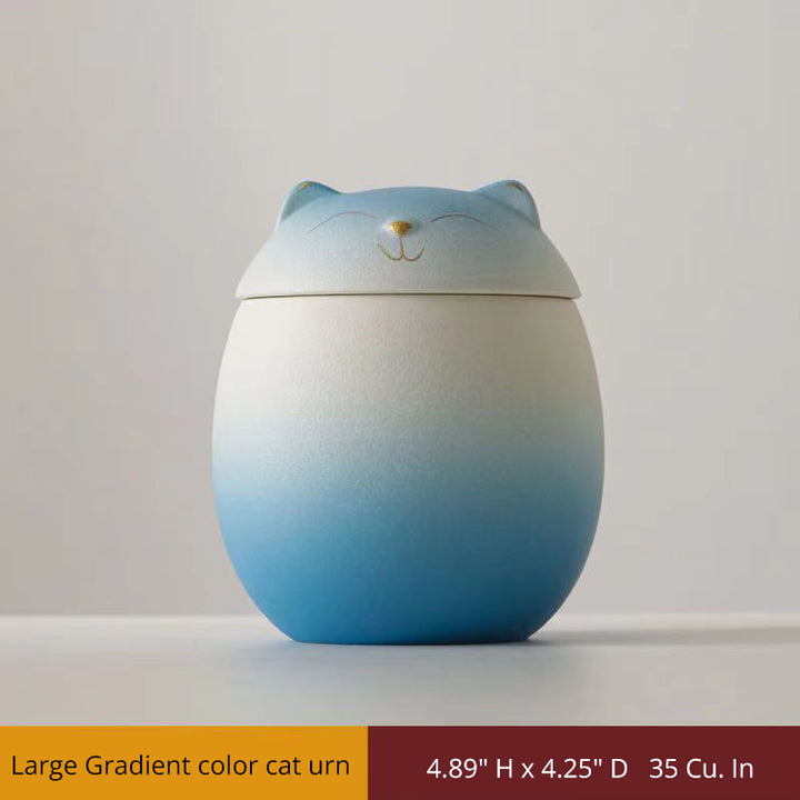 Gradient color cat urn on a plain background