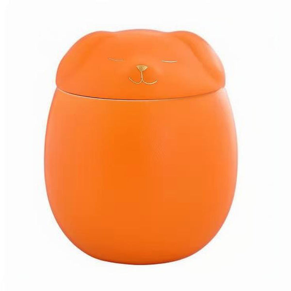 Orange container with a lid featuring a cat face design on a white background